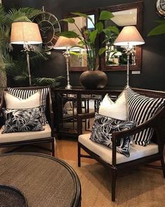 a living room filled with lots of furniture and lamps on top of it's tables