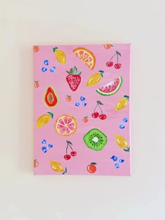 a pink painting with fruit and berries on it