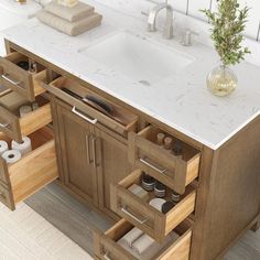 a bathroom vanity with two sinks and drawers