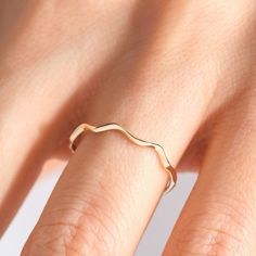 Here is Wave Ring Gold for girl! Our Wavy Ripple Stacking Ring is perfect compliment ring for wife. This Squiggle Chevron Ring is designed as chick dainty 10K 14K 18K Gold V Shape Band and Minimalistic Nesting Curved Ring for her.  This wave ring gold women is perfect combine ring 18K design as a wavy stacking ring for bride or girlfriend. Our chevron curved ring is perfect nesting stacked ring for bride, future wife and women.  This nesting stacked ring is also great engagement, wedding or special day comfort fitting ring gifted for girlfriend, future mrs wife, darling or yourself. Please check our other stackable gold rings: https://www.etsy.com/shop/Cristojuanna?ref=seller-platform-mcnav§ion_id=43773456 Ring Features: Band Width: 1.10 mm  Band Thickness: 1.30 mm We can make 10K 14K 18K Curved Ring, Curve Ring, Gold Rings Stackable, Wave Ring, Chevron Ring, Future Wife, Rings For Her, Stacking Ring, Ring Gold