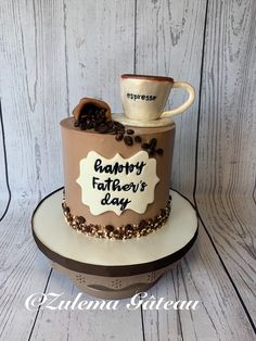 a birthday cake with coffee beans and a cup on top that says happy father's day