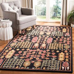 a living room area with a chair and rug