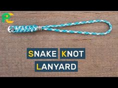 the snake knot lanyard is attached to a wooden board with blue and white rope