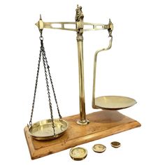 an old brass scale with some coins on it