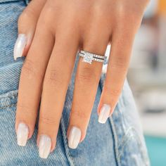 a woman's hand with a ring on her finger