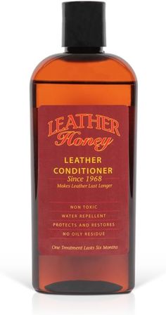 a bottle of leather conditioner on a white background with the words leather honey in it