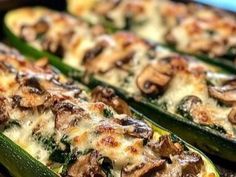 several slices of zucchini stuffed with mushrooms and cheese