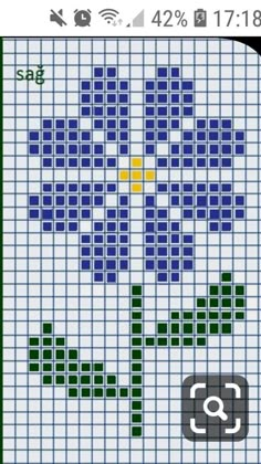 a cross stitch pattern with squares and numbers on the bottom right hand corner, as well as an arrow in the middle