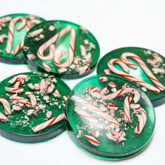 four green and white candy canes on top of each other