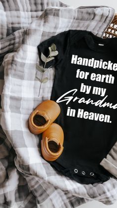 a black shirt that says, handpicked for earth by my grandma in heaven