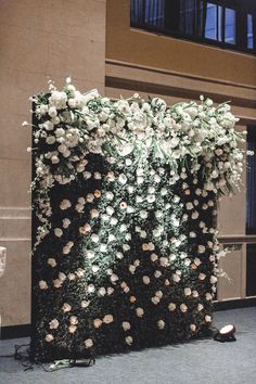 a large floral arrangement on the side of a building