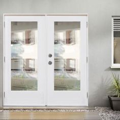 the front door to a house with two glass doors