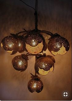 a chandelier with five lights hanging from it