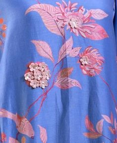 a blue dress with pink flowers on it