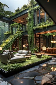 a living room filled with furniture and lots of greenery