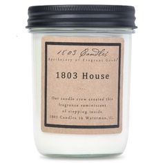 a candle with a label on it that says 1033 house