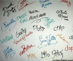 many different colored writing on a white wall