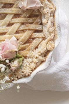 a close up of a pie with flowers on it