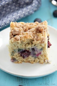 a piece of blueberry crumb coffee cake on a plate