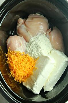 chicken, cheese and other ingredients in a slow cooker