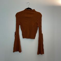 Lace Up Mock Neck Sweater Color: Copper Brown Cropped Top For Fall, Fitted Ribbed Brown Outerwear, Fitted Brown Ribbed Outerwear, Fitted Brown Sweater For Spring, Brown Ribbed Tops For Fall, Ribbed Brown Tops For Fall, Lavender Sweater, Olive Green Sweater, Puff Sleeve Sweater