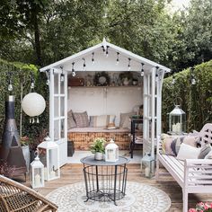 an outdoor living area with furniture and decor