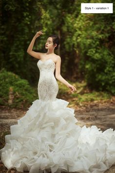 a woman in a wedding dress is posing for the camera