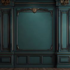 an empty room with green walls and wooden floors, decorated in gold trimmings