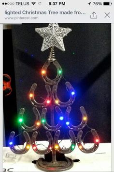 a lighted christmas tree made from horseshoes by anil art on etsy $ 75 00