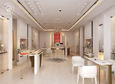 the interior of a jewelry store with white chairs and chandeliers hanging from the ceiling