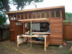 a small shed with a workbench in it