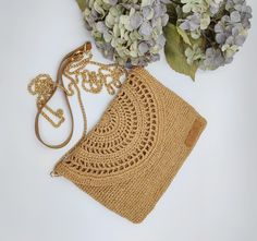 "Meet our crochet raffia crossbody bag, it will complete your bohemian summer look with a natural touch of raffia paper yarn. It can be used as a clutch bag by removing the strap! It's an everyday piece offering optimal capacity and easy transport with a long grab-and-go strap. It's also a great gift idea for your loved ones! Technical information : > It is exclusively handcrafted by talented women! > Main material 100% natural straw paper yarn > It has a 115cm long strap > The dimensions of the Summer Beach Crochet Clutch Bag, Elegant Jute Crochet Bag For Spring, Summer Vacation Crochet Clutch Bag, Elegant Crochet Jute Bag For Spring, Summer Crochet Beach Clutch, Straw Crochet Clutch Bag For Beach, Bohemian Clutch Straw Bag For Travel, Bohemian Straw Clutch Bag For Travel, Bohemian Straw Clutch For Travel