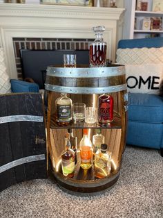 a wooden barrel with liquor bottles in it