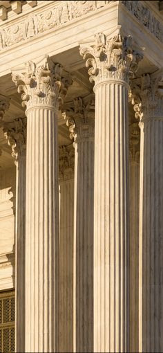 the supreme court building in washington d c, with columns and pillars on both sides