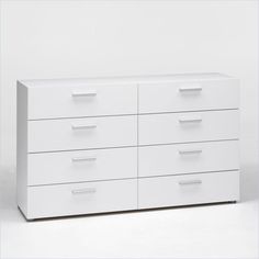 a white dresser with six drawers on it