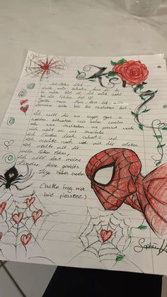 a drawing of a spiderman with roses on it's face and writing in the background