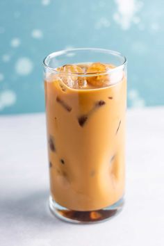 an iced drink in a glass on a table