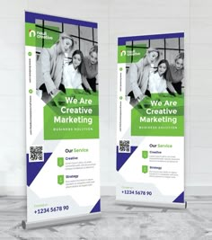 two roll up banners with people on them