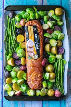 an assortment of vegetables including brussel sprouts, asparagus and potatoes