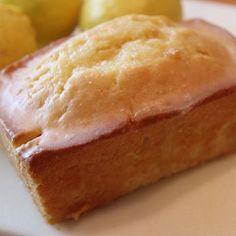 a loaf of lemon bread sitting on top of a white plate