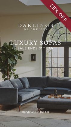 a couch and ottoman in front of a large window with the words, darings of chelsea luxury sofa sale ends 3 / 31