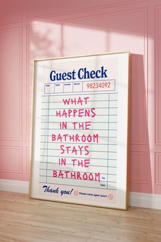 a bathroom sign in front of a pink wall with the words guest check written on it