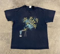 a blue t - shirt with stars on it