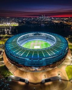 an aerial view of the soccer stadium at night with lights on it's roof