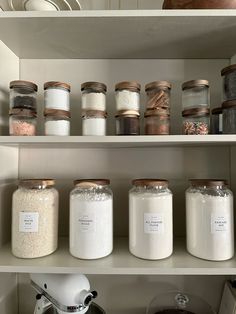 the shelves are filled with different types of spices