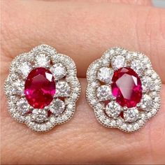 Anna Zuckerman Luxury Victoria 10 Carat Ruby Halo Stud Earrings In 925 Sterling Silver New!! Luxury Designer Azl Retail Price: $199 10 Carat Total (5 Ct Each Earring) 3 Carats Ruby (1.5 Ct Each Earring) 5 Carats (Total) Diamond Crystalline (2.5 Ctw Each Earring) Solid 925 Sterling Silver With Rhodium Plating Includes Gift Box & Jewelry Polishing Cloth July Birthstone Stunning Statement Jewelry! Each Earring Has A Faceted 1.5 Carat Oval Ruby Coated With Diamond Crystalline With 2.5 Carats Of Roun Art Deco Ruby Earrings, Classic Red Halo Design Earrings, Red Halo Design Earrings For Formal Occasions, Formal Red Halo Design Earrings, Red Halo Earrings For Formal Occasions, Classic Red Earrings With Halo Setting, Aaa Quality Red Jewelry For Formal Occasions, Gia Certified Ruby Earrings For Anniversary, Classic Silver Ruby Earrings