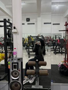 a person taking a selfie in a gym