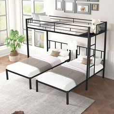 a bunk bed sitting next to a window on top of a hard wood floored floor