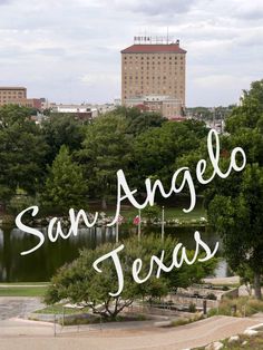 the words san angelo, texas are in front of a lake and trees with buildings in the background