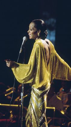 an image of a woman singing into a microphone